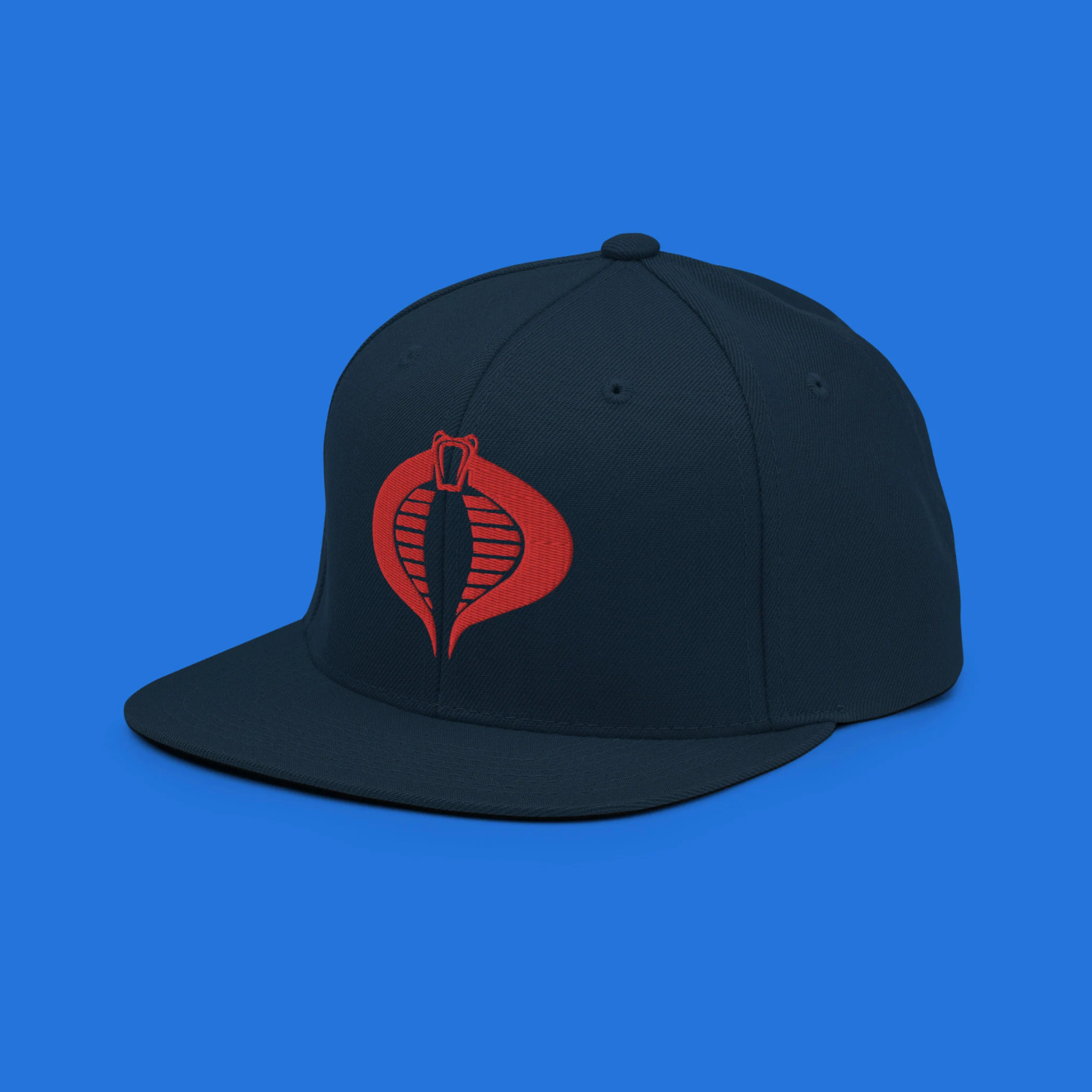 A snapback hat embroidered with the iconic Cobra logo from the GI Joe series, designed for fans and collectors. This high-quality, adjustable cap is perfect for showcasing allegiance to the renowned villain group with style and comfort.